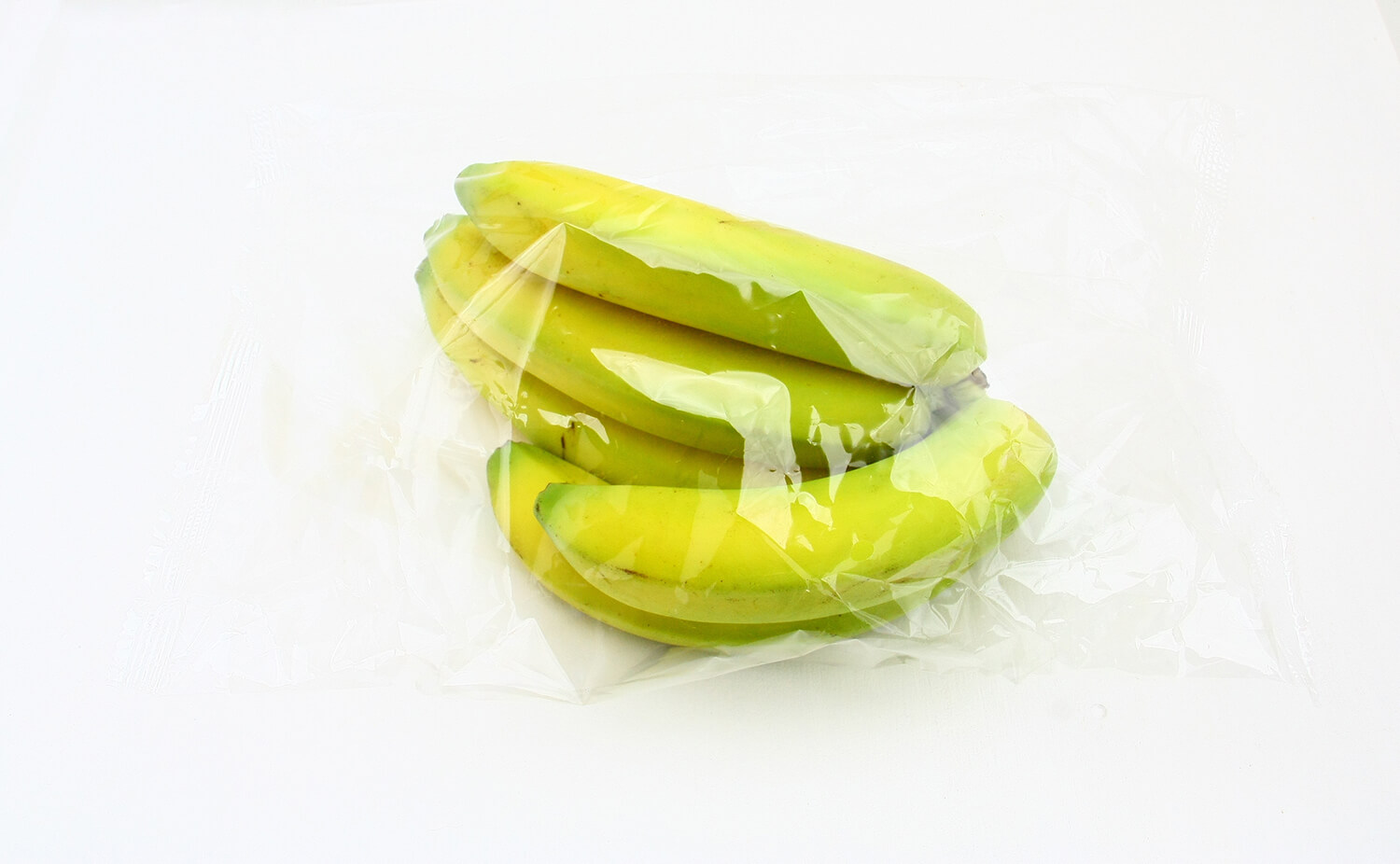 Plastik-verpackte Bananen